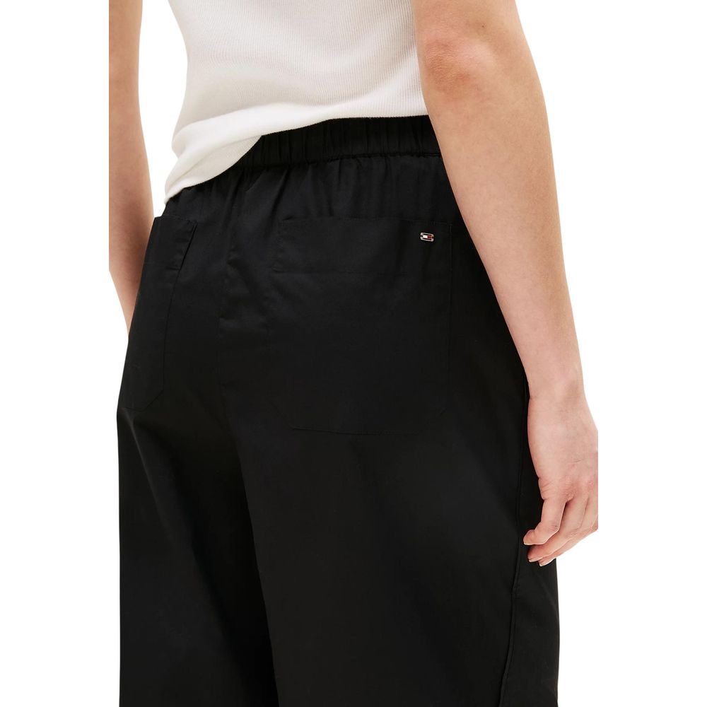 Trousers by Tommy Hilfiger for women in organic cotton black presents a smart silhouette, meticulously detailed with a smart flared, bootcut, relaxed-fit & wide, a smart long, and a smart .