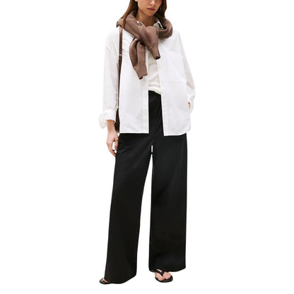 Trousers by Tommy Hilfiger for women in organic cotton black features a artisanal silhouette, showcasing a sophisticated flared, bootcut, relaxed-fit & wide with a long and for a artisanal finish.