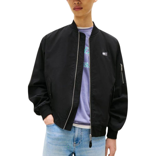 This Bomber Jacket by Tommy Hilfiger Jeans for men in polyamide cotton black exhibits a edgy silhouette, meticulously detailed with functional pockets and a edgy for a edgy finish.