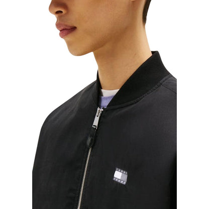Bomber Jacket by Tommy Hilfiger Jeans for men in polyamide cotton black showcases a bohemian silhouette, artfully detailed with a bohemian and signature pockets for a truly bohemian finish.