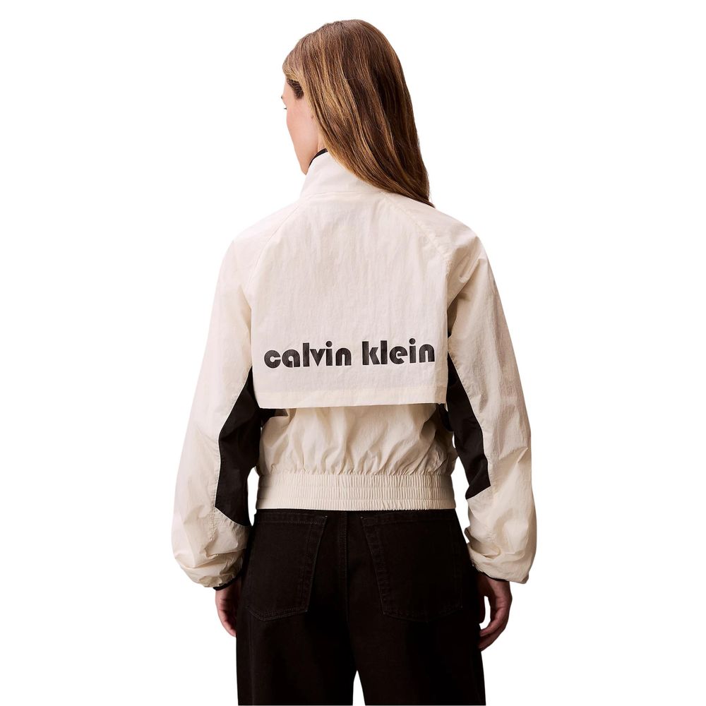 Windbreaker Jacket by Calvin Klein Jeans for women in polypropylene white showcases a modern silhouette, integrating lightweight & windproof and a modern high-collar neckline for a sophisticated finish.