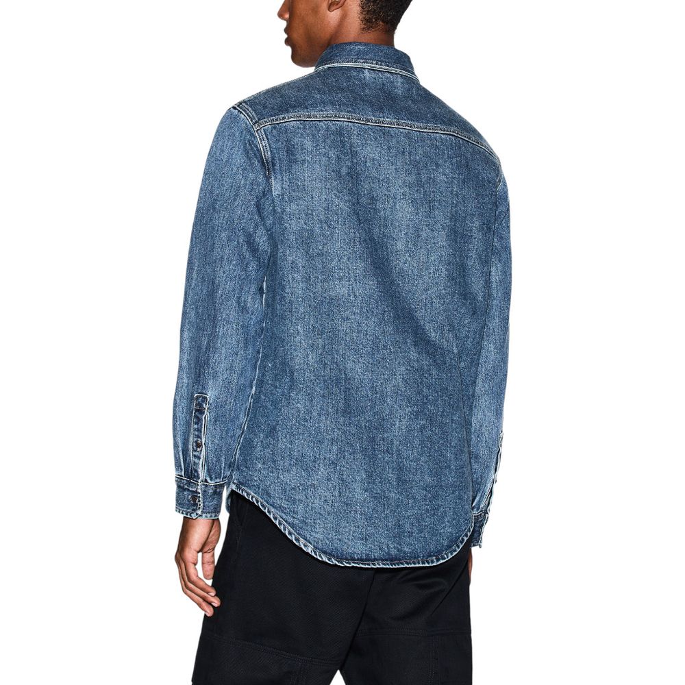 Shirt by Armani Exchange for men in stretch denim cotton blue features an polished silhouette, showcasing a sophisticated round neckline and detail for a truly polished finish.