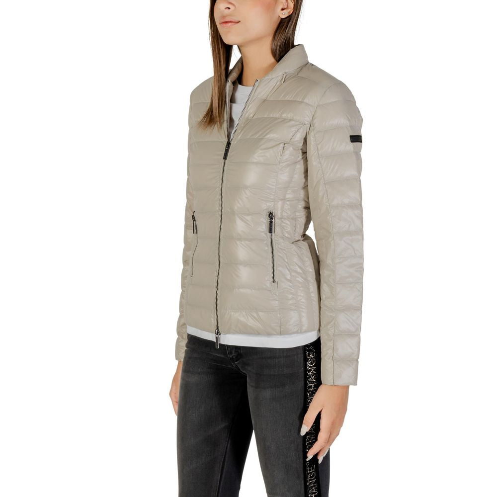 Overcoat by Armani Exchange for women in polyamide beige showcases a architectural silhouette, artfully detailed with a distinctive and functional lightweight, pockets & insulated for a architectural finish.