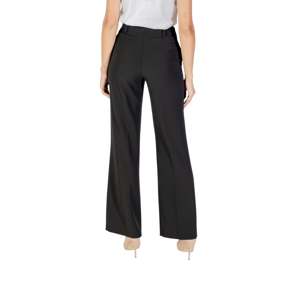 Trousers by Rinascimento for women in stretch polyester black features a sculptural silhouette, showcasing a sculptural straight-leg & wide and long with a sophisticated for a sculptural finish.