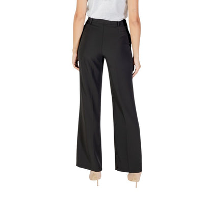 Trousers by Rinascimento for women in stretch polyester black features a sculptural silhouette, showcasing a sculptural straight-leg & wide and long with a sophisticated for a sculptural finish.