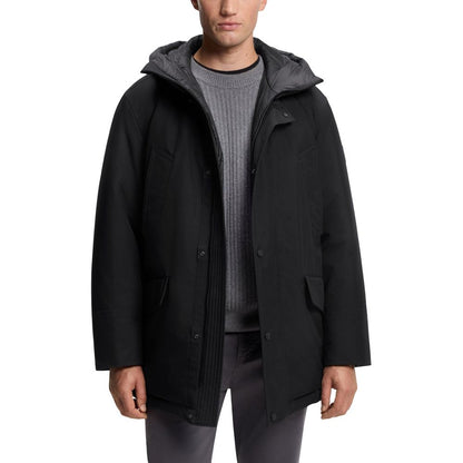 Hooded Trench Coat by Hugo Boss for men in polyester black presents a distinguished silhouette, artfully detailed with pockets & hooded and a distinguished hooded neckline for a sophisticated, distinguished finish.