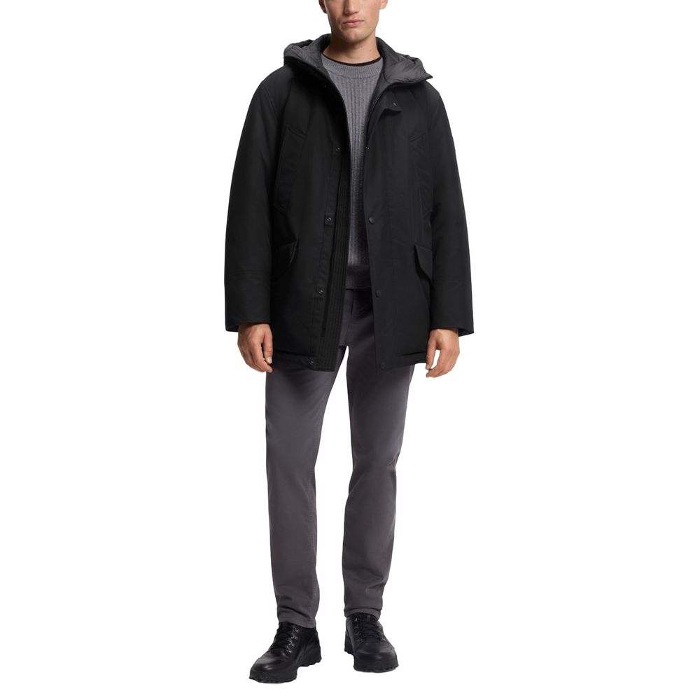 This Hugo Boss men polyester Hooded Trench Coat in black presents a high style silhouette, meticulously detailed with pockets & hooded and a high style hooded neckline for a sophisticated, timeless look.