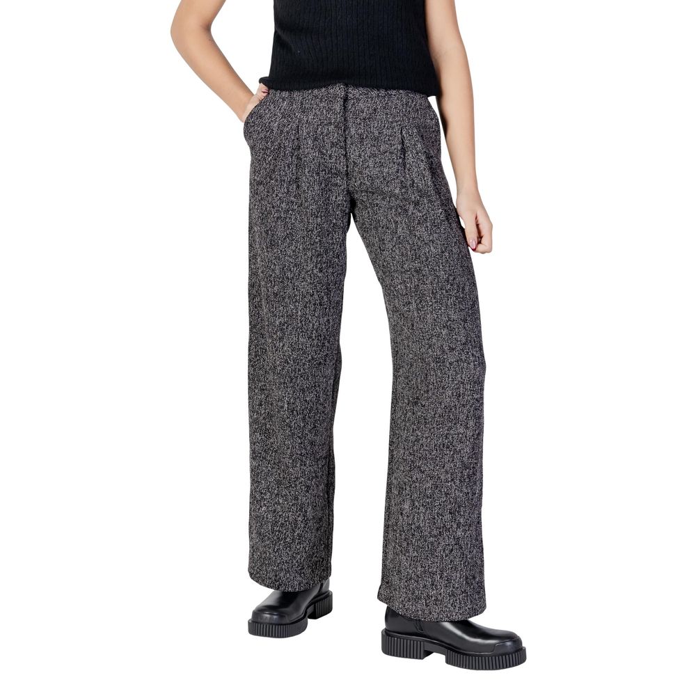 Trousers by Jacqueline De Yong for women in polyester & viscose black presents a perennial silhouette, meticulously tailored with a flared, bootcut, relaxed-fit & wide cut, long finish, and an elegant high rise.