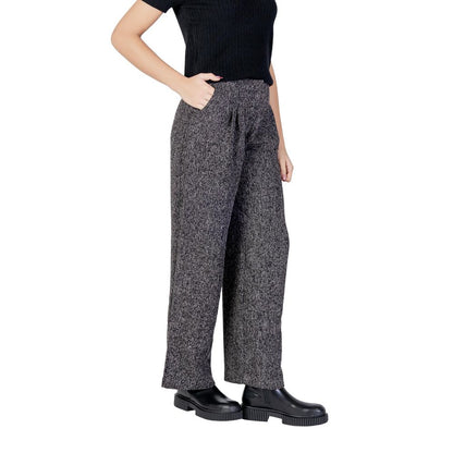 Trousers by Jacqueline De Yong for women in polyester & viscose black presents a smart silhouette, meticulously detailed with a smart flared, bootcut, relaxed-fit & wide, a smart long, and a smart high rise.