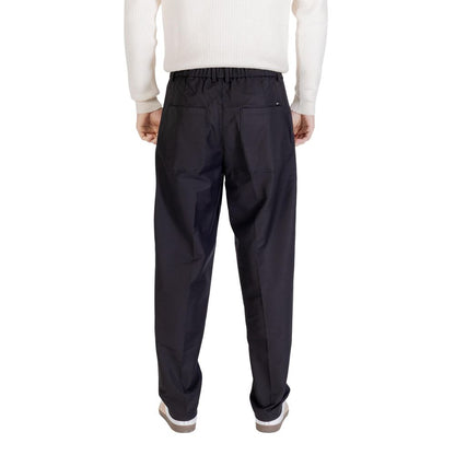 Trousers by Gianni Lupo for men in stretch polyester cotton black features a sculptural silhouette, showcasing a sculptural regular-fit and long with a sophisticated for a sculptural finish.