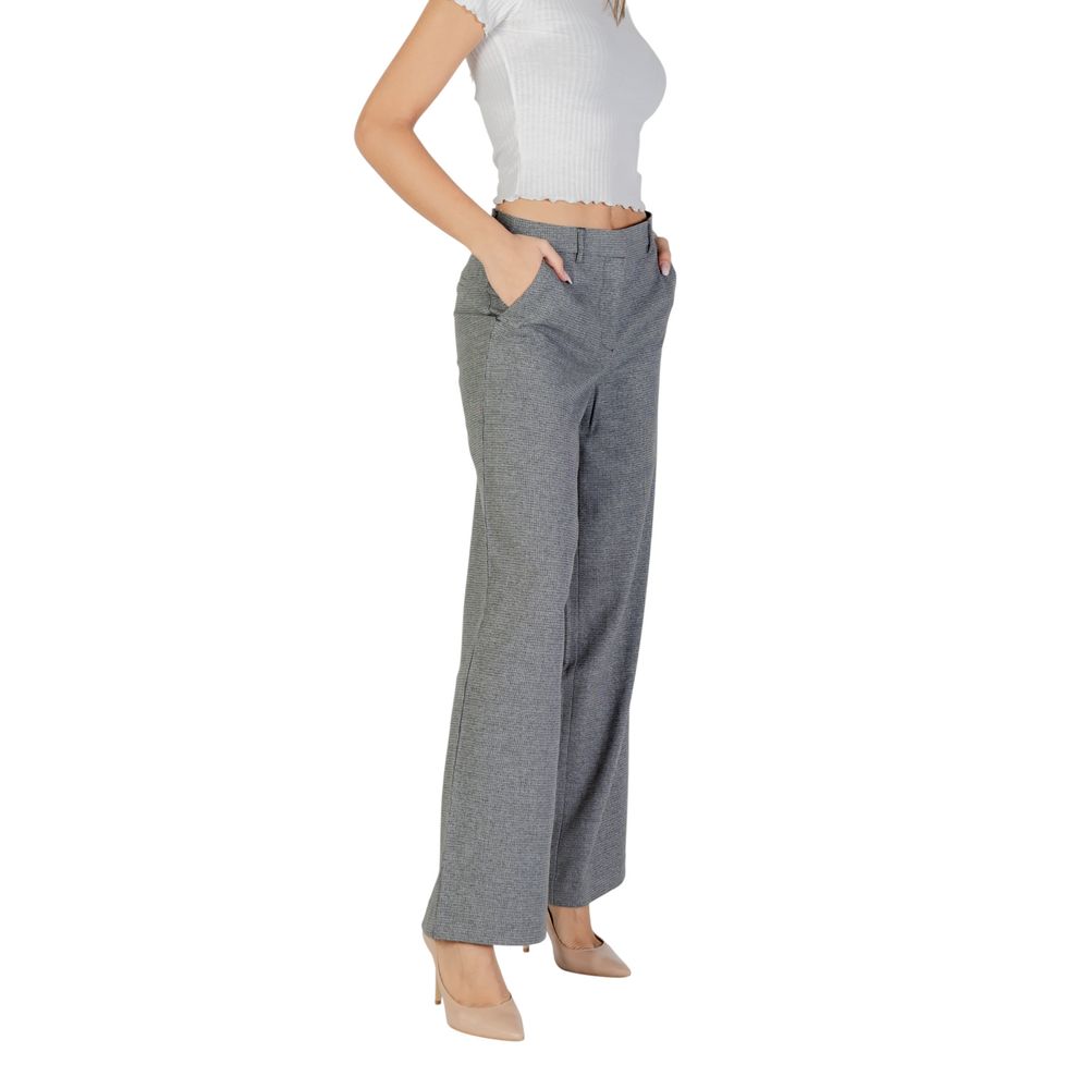 Trousers by Only for women in stretch polyester & viscose gray presents a perennial silhouette, meticulously tailored with a wide cut, long finish, and an elegant mid rise.