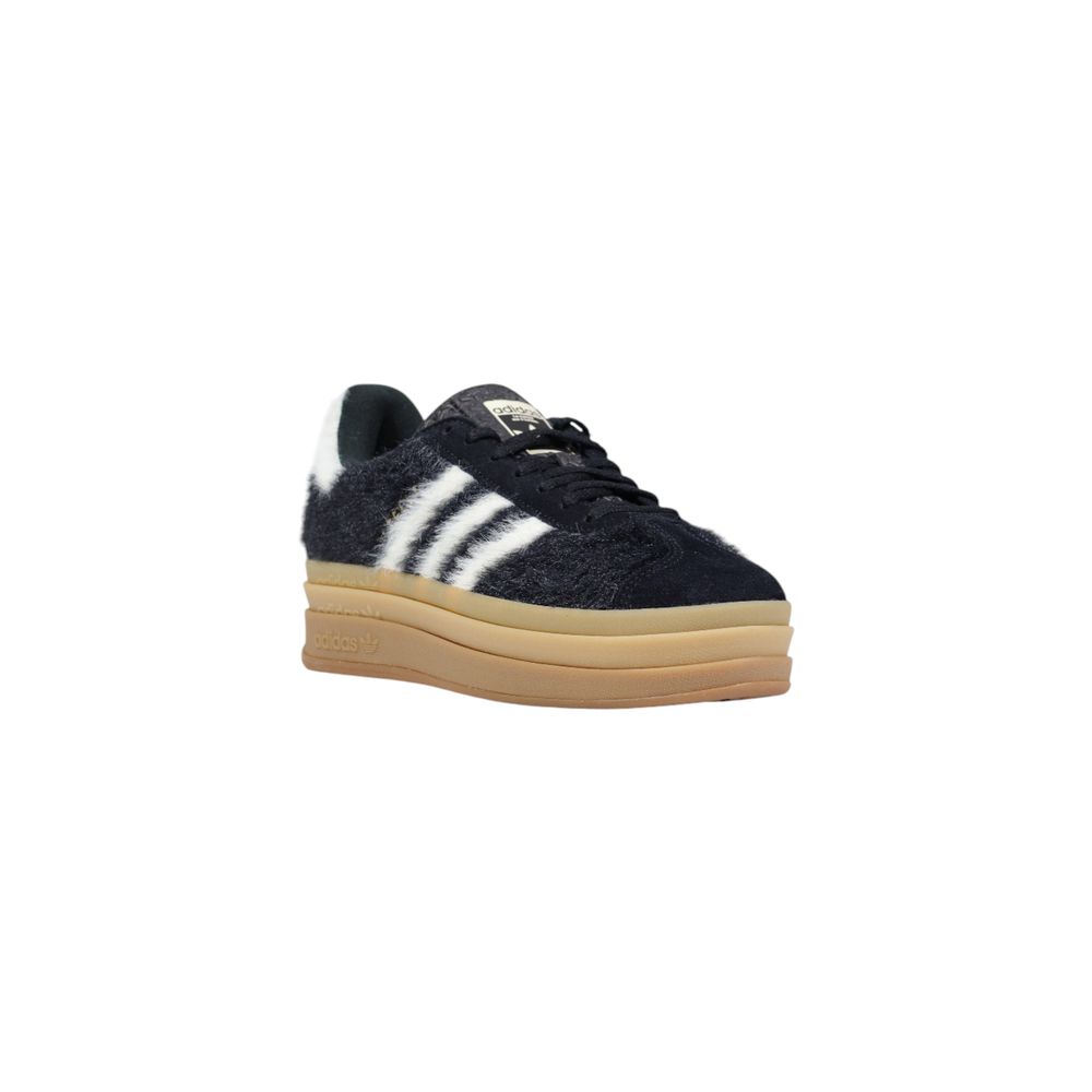 Sneakers by Adidas Originals for women in leather & rubber black & striped presents a sumptuous silhouette, artfully capturing the essence of the Women's Casual Leather & Rubber Sneakers with its sumptuous casual style design.