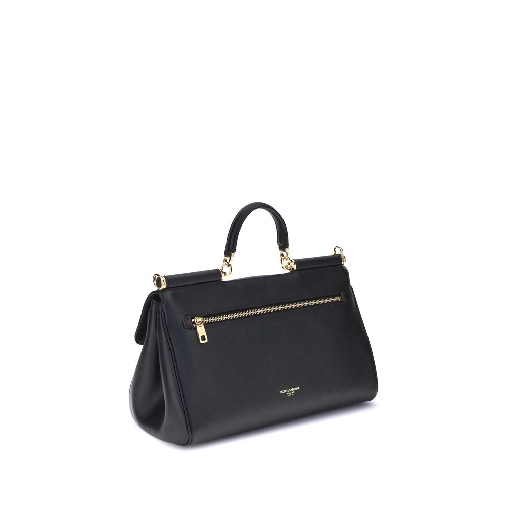Flap Shoulder Bag by Dolce & Gabbana for women in bos taurus calf leather black & signature features a enviable silhouette, showcasing a secure flap & magnetic, ample single-compartment, and enviable shoulder-strap, handle & adjustable-strap for a enviable finish.