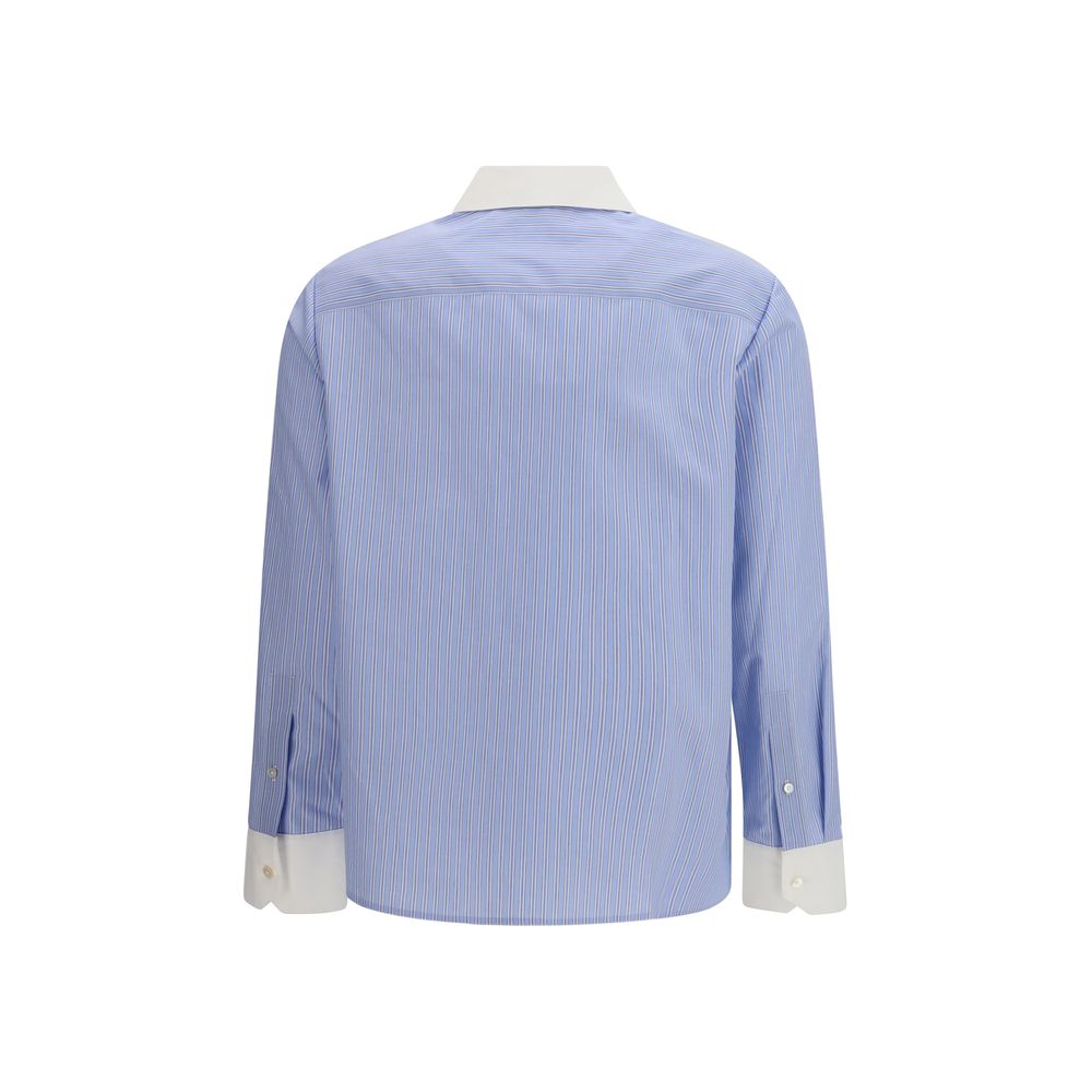 Shirt by Tory Burch for women in cotton blue, patterned & striped showcases a sharp silhouette, elegantly detailed with a sharp and sharp .