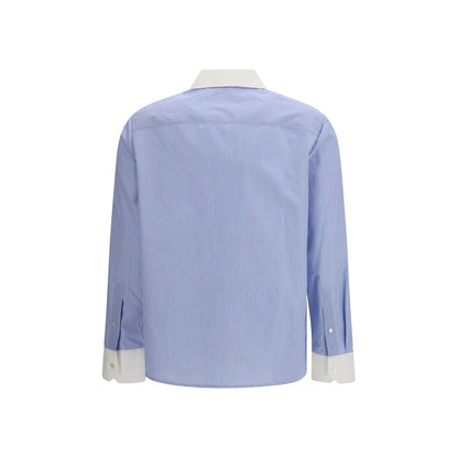Shirt by Tory Burch for women in cotton blue, patterned & striped showcases a sharp silhouette, elegantly detailed with a sharp and sharp .