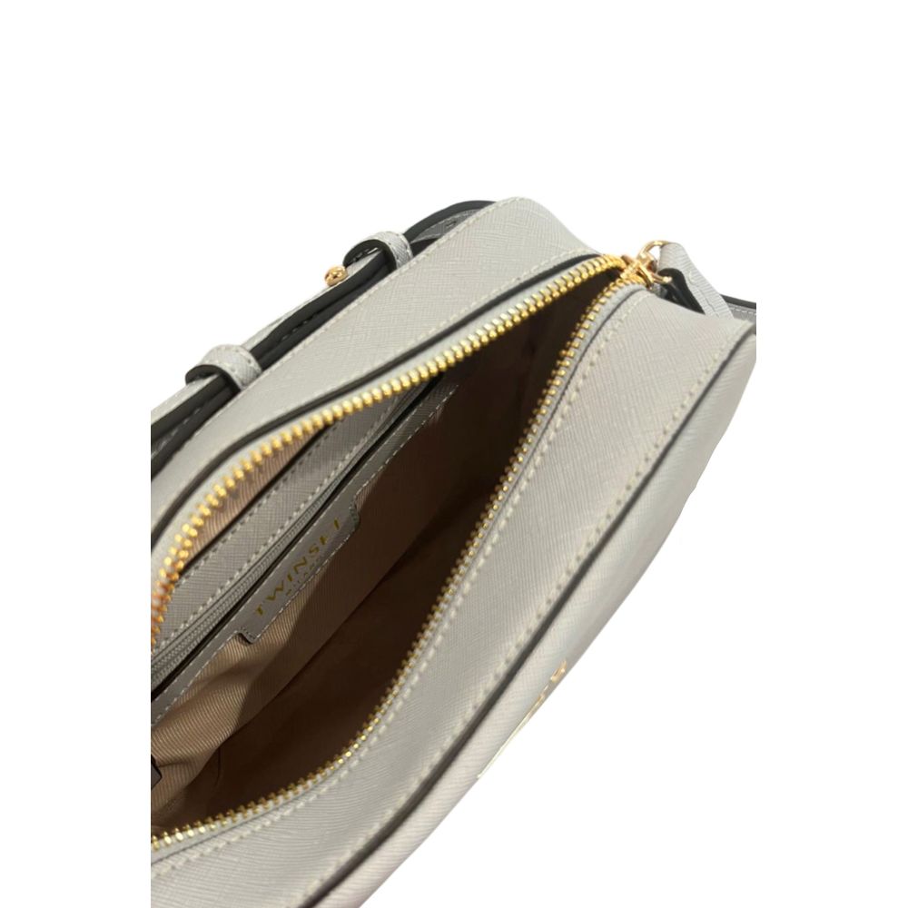 Crossbody Handbag by Twinset for women in polyurethane blue & gold features a transformative elegance silhouette, showcasing a secure zipper, organized built-in-compartments, and versatile crossbody-strap, shoulder-strap & adjustable-strap for a transformative elegance look.
