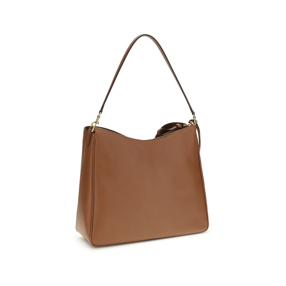 Large Shoulder Bag by Balenciaga for women in bos taurus calf leather beige & gold showcases a enviable silhouette, artfully detailed with a secure zipper & turn-lock, organized external-pockets, and versatile shoulder-strap & handle for a enviable look.
