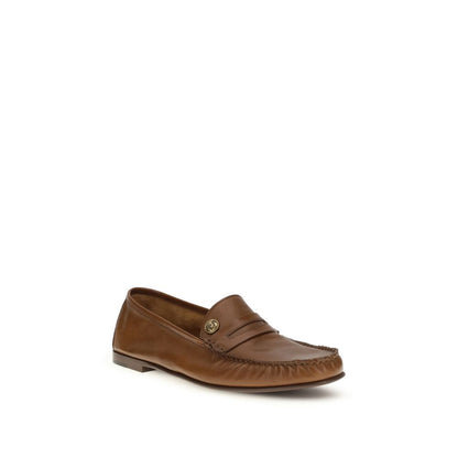 Loafer Slip-On Shoes by Versace for men in bos taurus calf leather brown showcases a impeccable silhouette as Medusa Men's Bos Taurus Calf Leather Loafer Slip-On Shoes, artfully designed with a impeccable and refined for a impeccable finish.