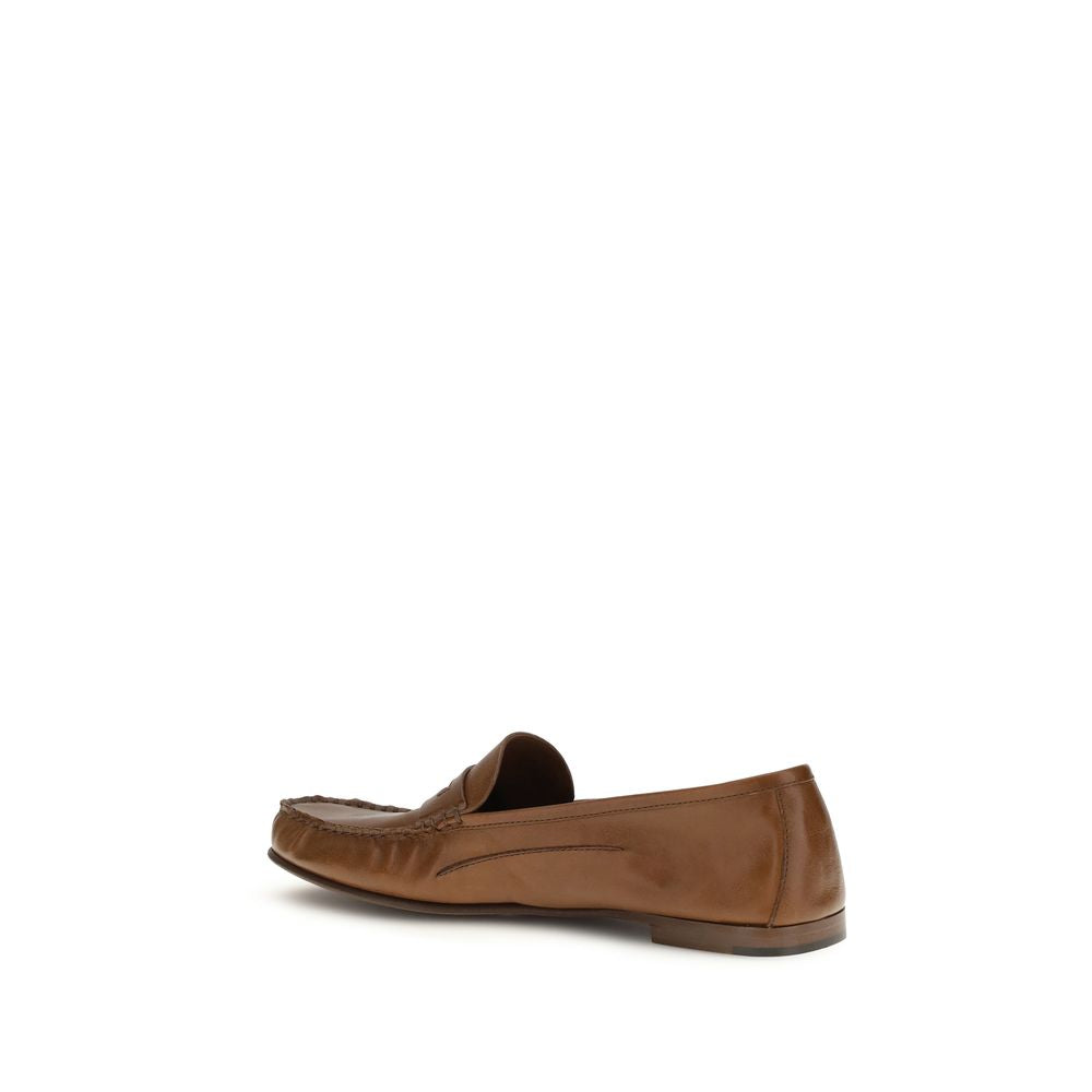 Loafer Slip-On Shoes by Versace for men in bos taurus calf leather brown features an dynamic silhouette from the Medusa Men's Bos Taurus Calf Leather Loafer Slip-On Shoes collection, defined by a dynamic and for a dynamic look.