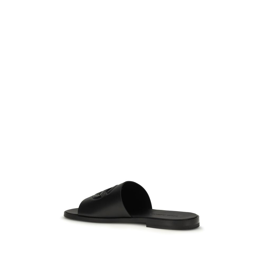 Flat Sandals by Dolce & Gabbana for men in bos taurus calf leather black features an statuesque Men's Bos Taurus Calf Leather Flat Sandals silhouette with a refined flat and elegant open toe style.