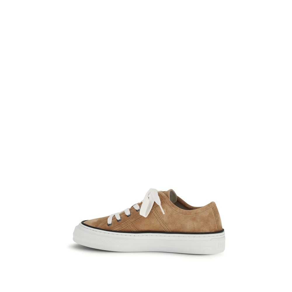 Sneakers by Brunello Cucinelli for women in bos taurus suede calf leather beige presents a sumptuous silhouette, artfully capturing the essence of the Women's Low Top Bos Taurus Suede Calf Leather Sneakers with its sumptuous low-top style design.