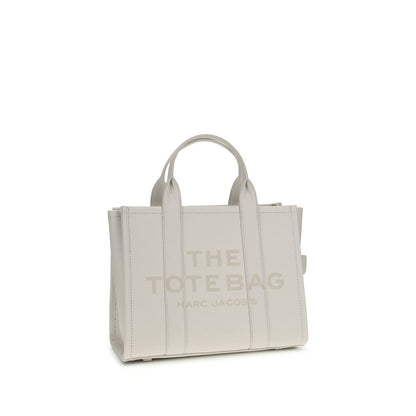 Medium Tote Handbag by Marc Jacobs for women in bos taurus calf grained leather white, patterned & monogram features a signature silhouette, showcasing a secure zipper and signature with versatile shoulder-strap, handle & adjustable-strap for a sophisticated look.
