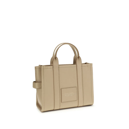 Medium Tote Handbag by Marc Jacobs for women in bos taurus calf grained leather beige & monogram features a signature silhouette, showcasing a secure zipper and signature with versatile shoulder-strap, adjustable-strap & handle for a sophisticated look.