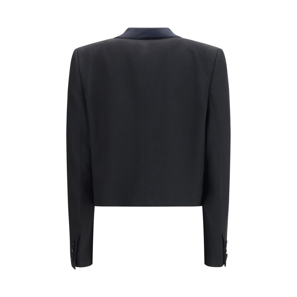 Overcoat by Tom Ford for women in wool black showcases a enveloping silhouette, detailed with distinctive pockets and a enveloping shawl-collar neckline.