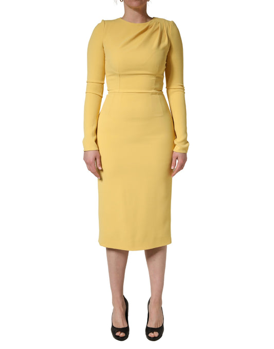 Dress by Dolce & Gabbana for women in calf leather cotton & silk yellow showcases a striking silhouette, elegantly detailed with a long-sleeve, refined , and a striking midi for a striking finish.