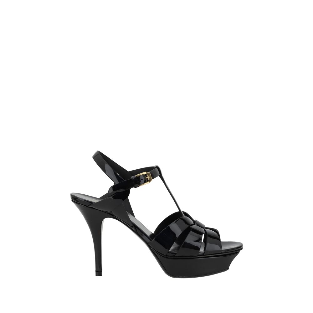 Platform Stiletto Ankle Strap Sandals by Saint Laurent for women in bos taurus calf patent leather and black presents a captivating silhouette, showcasing the signature style of the Women's Bos Taurus Calf Patent Leather Platform Stiletto Ankle Strap Sandals with a captivating stiletto platform and captivating .