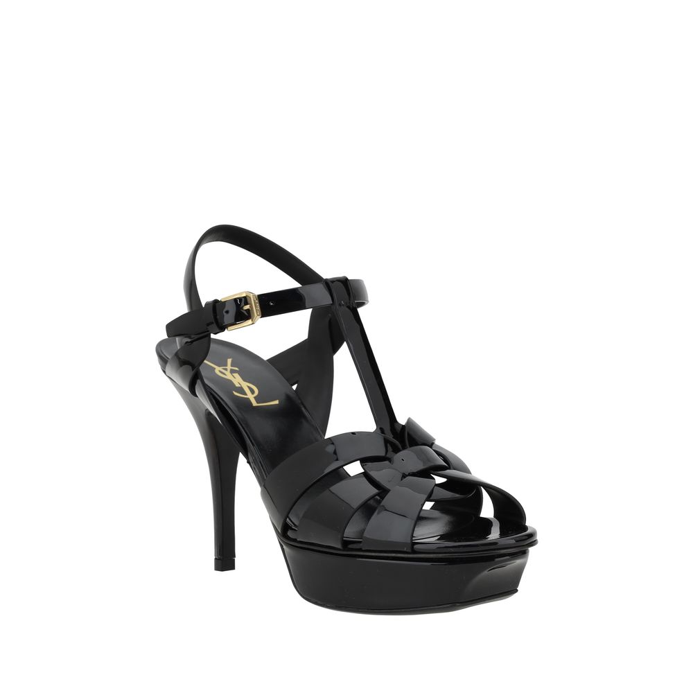 Platform Stiletto Ankle Strap Sandals by Saint Laurent for women in bos taurus calf patent leather black features an statuesque Women's Bos Taurus Calf Patent Leather Platform Stiletto Ankle Strap Sandals silhouette with a refined stiletto platform and elegant .
