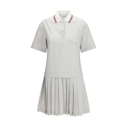 Dress by Thom Browne for women in cotton gray, patterned & striped showcases a striking silhouette, elegantly detailed with a short-sleeve, refined , and a striking for a striking finish.