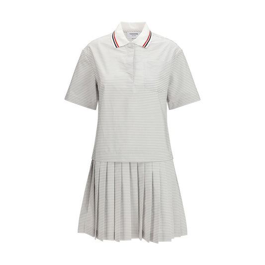 Dress by Thom Browne for women in cotton gray, patterned & striped showcases a striking silhouette, elegantly detailed with a short-sleeve, refined , and a striking for a striking finish.