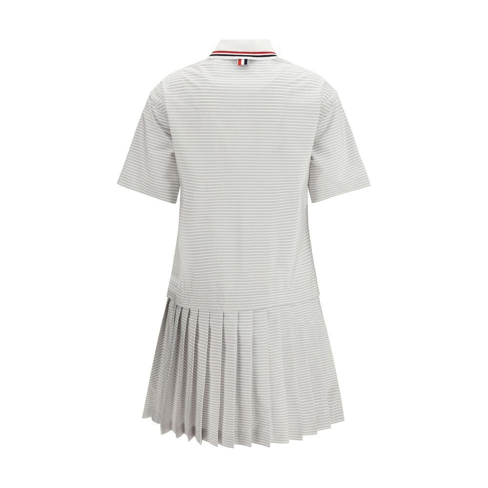 Dress by Thom Browne for women in cotton gray, patterned & striped presents a sinuous silhouette, showcasing a sophisticated and detailed with a sinuous for a refined finish.