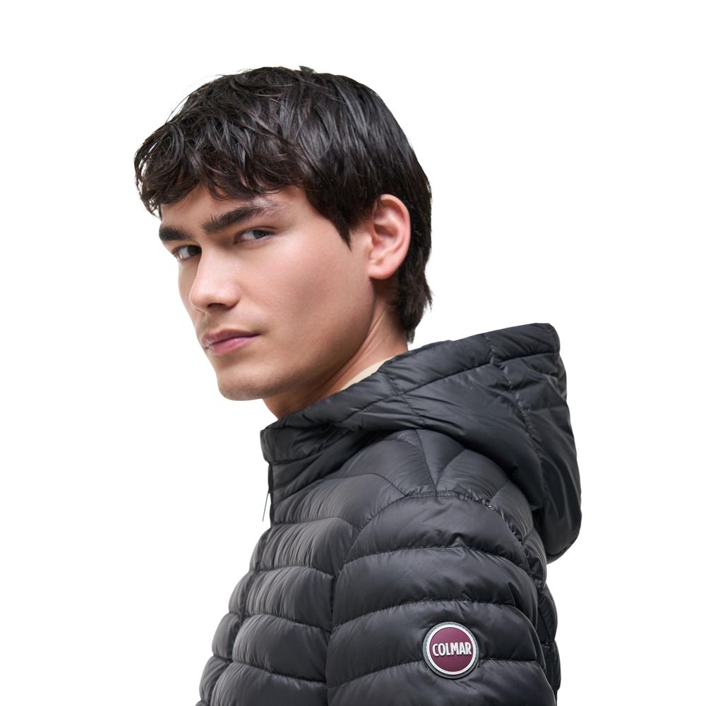 Hooded Overcoat by Colmar Originals for men in polyamide black features a cosy chic silhouette, artfully detailed with a sophisticated hooded neckline and premium lightweight, pockets, hooded & insulated for a cosy chic finish.
