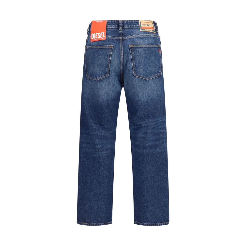Jeans by Diesel for men in denim cotton blue features an refined tailoring silhouette, showcasing a premium tapered-leg & regular-fit with a mid rise and long cut for a refined tailoring look.
