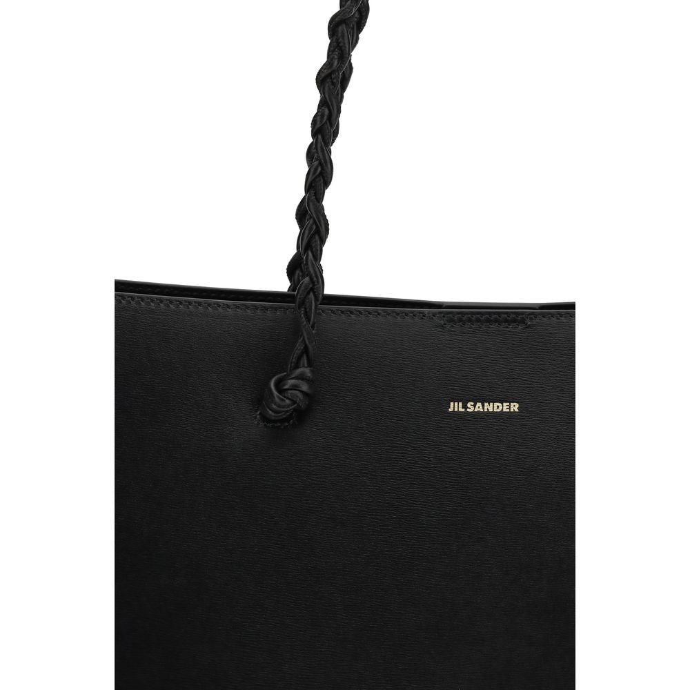 Tote Shoulder Bag by Jil Sander for women in bos taurus calf leather black & signature features a effortless sophistication silhouette, secured by a magnetic & button with ample and versatile handle for a effortless sophistication finish.