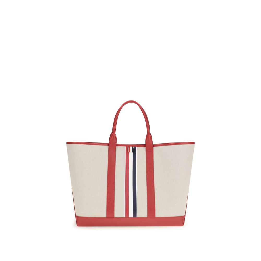 Large Tote Shoulder Bag by Thom Browne for men in cotton canvas & bos taurus calfskin leather black, multicolor, red, white, signature & striped features a effortless chic silhouette with a secure , ample , and versatile handle for a effortless chic finish.