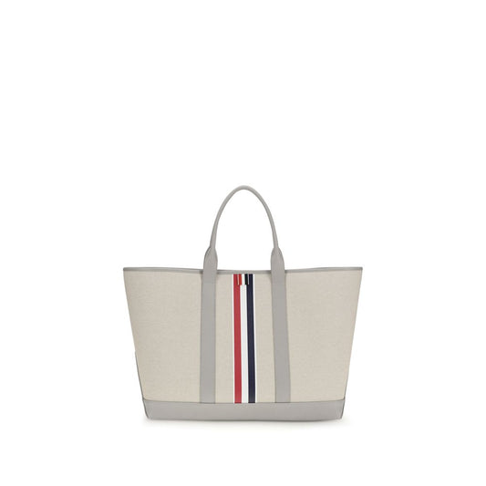 Large Tote Shoulder Bag by Thom Browne for men in cotton canvas & bos taurus calfskin leather black, gray, red, white & striped features a effortless sophistication silhouette, secured by a with ample and versatile handle for a effortless sophistication finish.