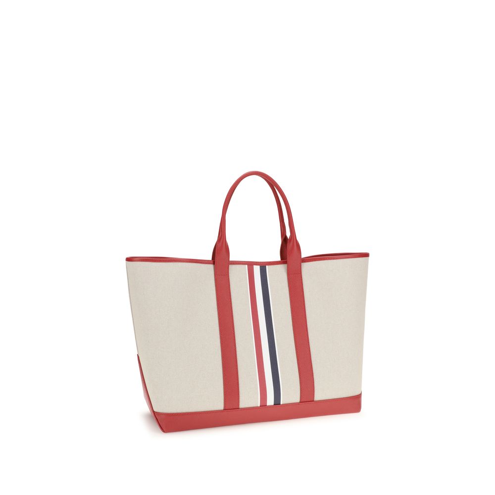 Large Tote Shoulder Bag by Thom Browne for men in cotton canvas & bos taurus calfskin leather black, multicolor, red, white, signature & striped features an effortlessly chic silhouette with a secure , ample , and versatile handle for effortlessly chic everyday luxury.