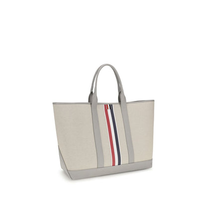 Large Tote Shoulder Bag by Thom Browne for men in cotton canvas & bos taurus calfskin leather black, gray, red, white & striped features a distinguished silhouette, showcasing a secure and distinguished with versatile handle for a distinguished finish.