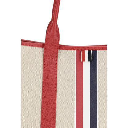 Large Tote Shoulder Bag by Thom Browne for men in cotton canvas & bos taurus calfskin leather black, multicolor, red, white, signature & striped features a effortless chic silhouette with a secure , ample , and versatile handle for a effortless chic finish.