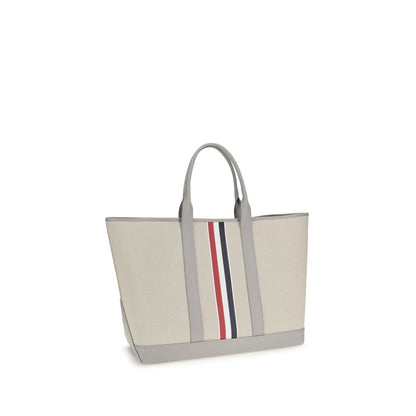 Large Tote Shoulder Bag by Thom Browne for men in cotton canvas & bos taurus calfskin leather black, gray, red, white & striped showcases a enviable silhouette, artfully detailed with a secure , organized , and versatile handle for a enviable look.
