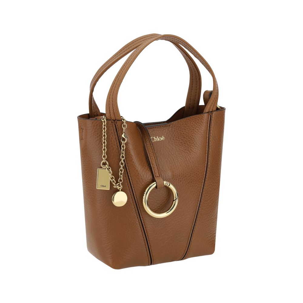 Shoulder Bag by Chloé for women in bos taurus grained leather brown, signature & monogram features a enviable silhouette, showcasing a secure magnetic & button, ample single-compartment, and enviable shoulder-strap, handle & adjustable-strap for a enviable finish.