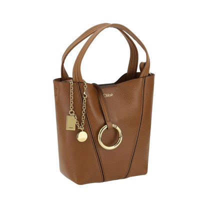 Shoulder Bag by Chloé for women in bos taurus grained leather brown, signature & monogram features a enviable silhouette, showcasing a secure magnetic & button, ample single-compartment, and enviable shoulder-strap, handle & adjustable-strap for a enviable finish.