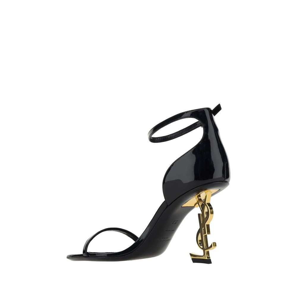 Stiletto Geometric Sandals by Saint Laurent for women in bos taurus patent calfskin leather black & gold features an effortlessly chic silhouette from the Women's Bos Taurus Patent Calfskin Leather Stiletto Geometric Sandals collection, showcasing a effortlessly chic stiletto geometric-heel and elegant square toe style.