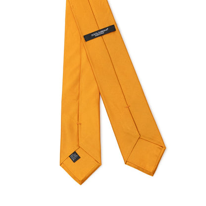 Necktie by Dolce & Gabbana for men in silk orange showcases a stately silhouette, expertly detailed with a stately finish that perfectly captures the sophisticated essence of the Silk Necktie.