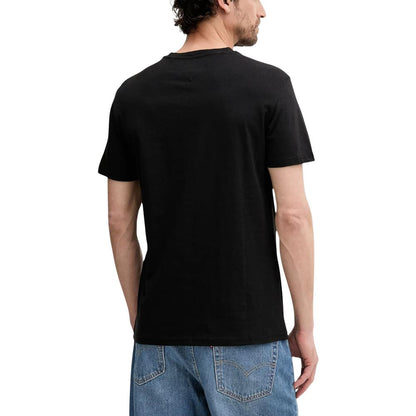 T-Shirt by Tommy Hilfiger Jeans for men in cotton black features an on trend silhouette, perfectly showcasing a on trend and for an elevated aesthetic.