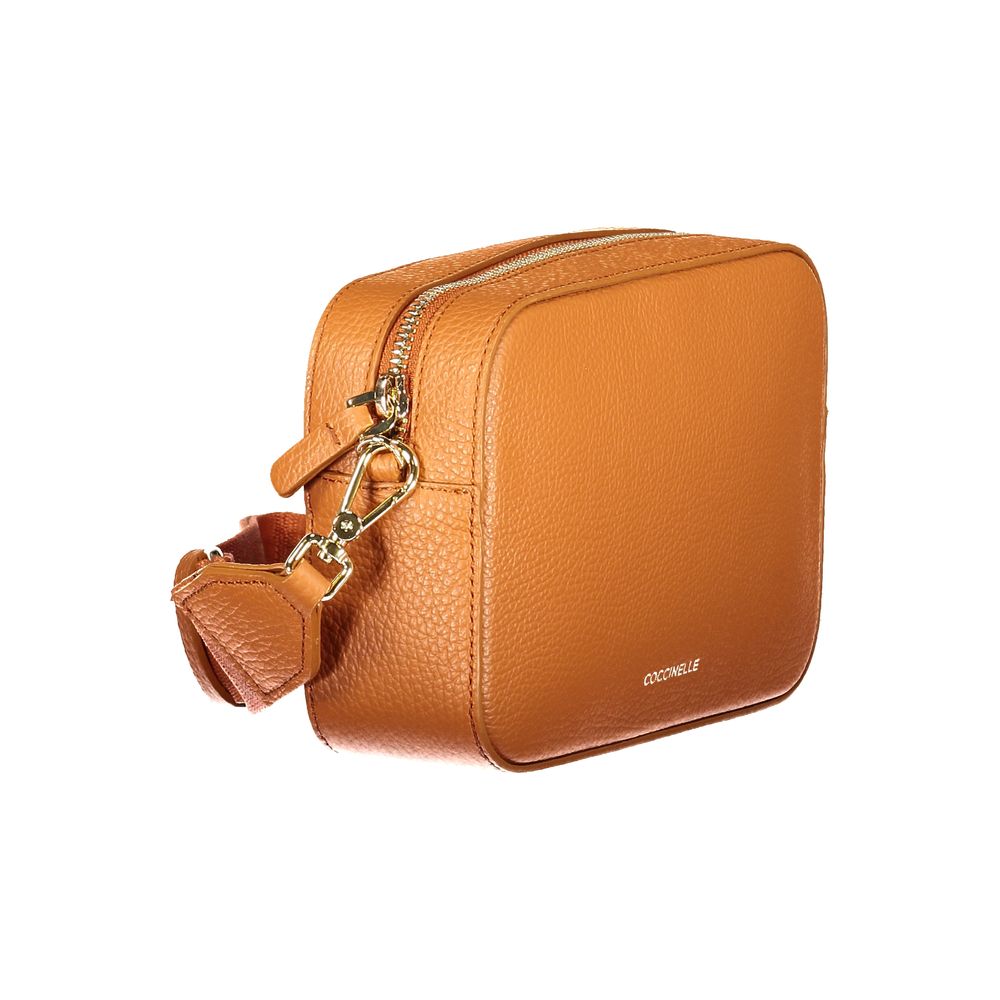Handbag by Coccinelle for women in leather orange features an refined silhouette, showcasing a secure , ample , and versatile for a sophisticated refined aesthetic.
