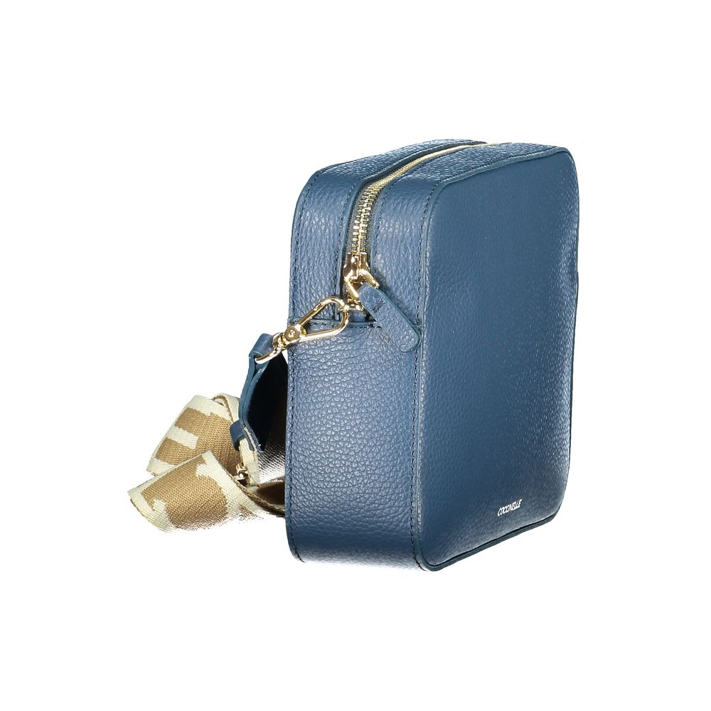 Handbag by Coccinelle for women in leather blue & sapphire features a refined silhouette, showcasing a secure , organized , and versatile for a refined finish.